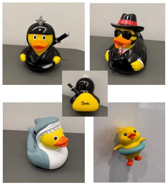 忍者、マフィア、サメの着ぐるみ、浮き輪をつけた姿など、様々なキャラクターに変身したアヒルのおもちゃのコレクション画像